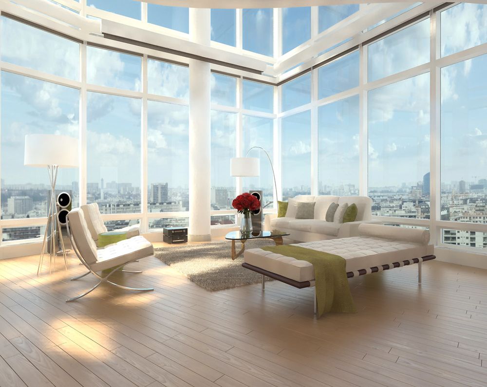 A penthouse with floor-to-ceiling windows over a city skyline and a single daybed